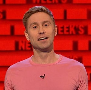 Russell Howard swigs cider during interview with Lorraine Kelly