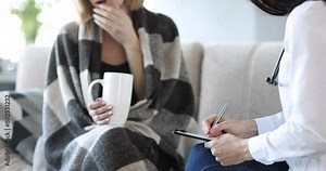 Doctor consults woman with strong cough at home. Bronchitis and signs of pneumonia concept