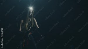 Beautiful muscular woman exercising on a rope in gym. Functional training. Motivation. Success concept. Crossfit Focus. Filmed on Cinema Camera in 4K. Professional cinema lighting.