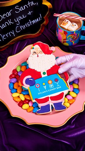 Take a bite out of Christmas with our oversized Santa Sugar Cookie 🎅 Fun Fact: This treat was exclusively designed by our Founder and CEO Dylan Lauren! | Dylan's Candy Bar