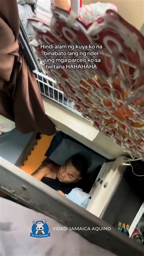 'BATO-BATO SA LANGIT, ANG TAMAAN 'WAG MAGALIT' 📦 WATCH: A netizen from Taguig City posted a hilarious video of her brother being startled when a delivery rider accidentally tossed her parcels onto him. Uploader Jamaica Aquino told the Inquirer that, since she usually receives many parcels, she instructed her delivery riders to throw them through the window every time. Coincidentally, her brother, who was visiting from Laguna and unaware of the parcel delivery arrangement, was resting by the win