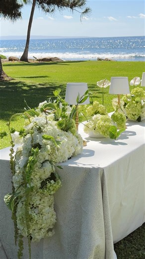 Bella Bloom on Instagram: "A look at how we created these cascading table florals! The perfect touch to elevate a tablescape✨ Designed using hydrangea, lisianthus, green amaranthus, anthuriums, and bells of Ireland for a garden-inspired moment. #weddingflorals #floraldesign #cascadingflorals #tablescape #Hawaiiwedding #hawaiiflorist #weddinginspo #modernflorals #flowers #florist #weddingdetails #eventflorals"