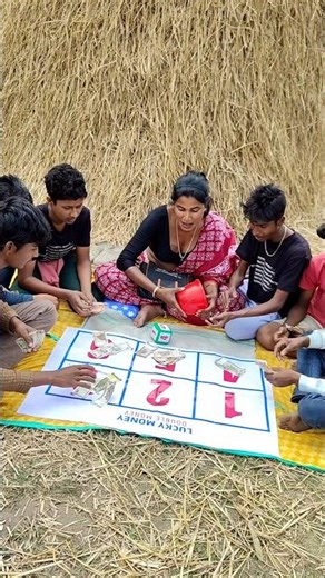 See the girl earning money by playing numbers games.