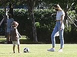 Candice Swanepoel plays soccer with her children in Miami, FL