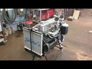 Hopped up chevy 216 engine open headers