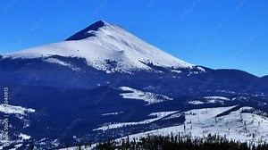 Cold sunny snowy winter Colorado aerial drone Boreas Pass Breckenridge Dillon Frisco Silverthorne Keystone landscape view Grays and Torreys fourteener i70 circle right slowly zoomed in