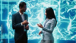 Computer scientists use AI neural networks modeled after human brain to solve complex problems. Startup employees using artificial intelligence to look at data and complete tasks, camera A