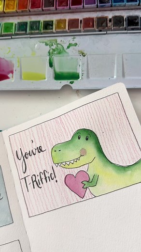 Supplies are my brand and are at https://www.adreamoradayart.com/ Supplies: Watercolor sketchbook 24 color essential palette Size 6 round brush Tape Pen Colored pencils This is Day 16 of our 30 day sketchbook project and it’s Dinomite! 🦖 Don’t be scared of the drawing on this one. the derpier, the better! The white gel pen is on Amazon https://www.amazon.com/shop/influencer-99922a4c #2026sketchbook