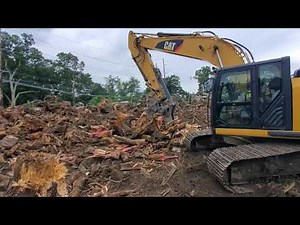 quick coupler compatible excavator stump splitter in action on a CAT 320E