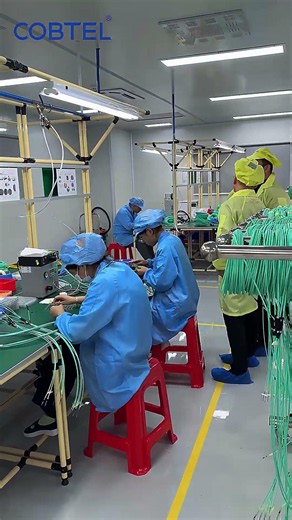 COBTEL fiber optic products workshop and production line display.