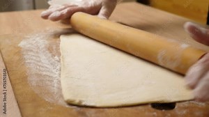 Preparation and rolling out puff pastry. Preparation of puff pastry dishes.
