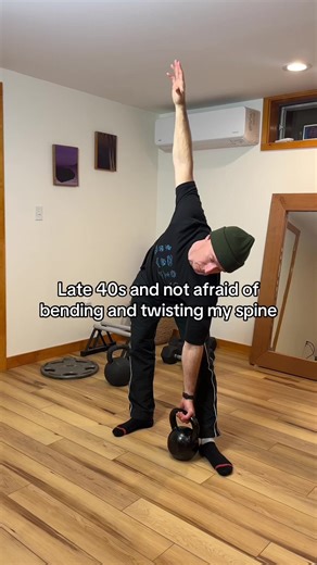 Low kettlebell windmills are a cool variation to throw in the mix if overhead motion is giving you pause. #kettlebelltraining #homefitness #fitover40