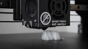 3d printer printing a white object, close-up
