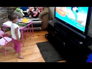 Abby doing the kitty cat dance with Dora :)