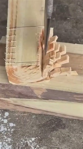 chiseling detailed wooden joints manually using sharp industrial metal tools