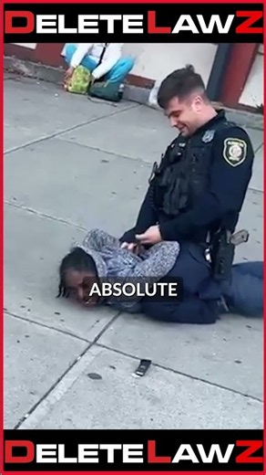 COP HOLDS WOMAN DOWN AND THREATENING TO P*NCHE HER!