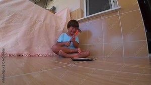 HD Slow motion Furious child destroying his tablet PC with a hammer, slow motion
