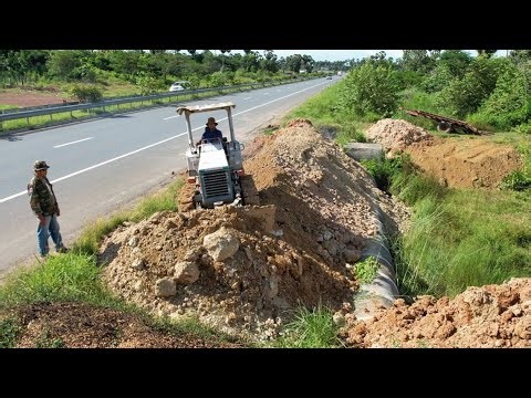 Buried drainage system next to the twin road. Drivers passing by must be very careful.