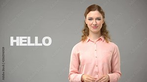 Woman saying hello in sign language, text on background, communication for deaf