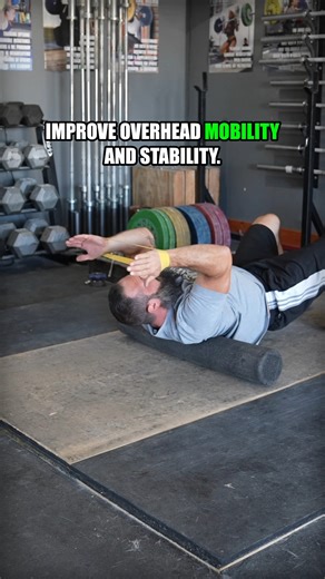 Add this to your warm-up to improve your overhead mobility and stability. 10-15 reps should be plenty—just remember to try to gradually reach farther back. Use a controlled tempo in both directions to ensure control and a continuous active effort against the tension. Keep your forearms approximately parallel to each other with constant tension out against the band. #shouldermobility #overheadmobility #snatchmobility #jerkmobility #catalystathletics #garagemind | Catalyst Athletics