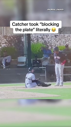 Baseball Catcher Blocking the Plate Stand Off