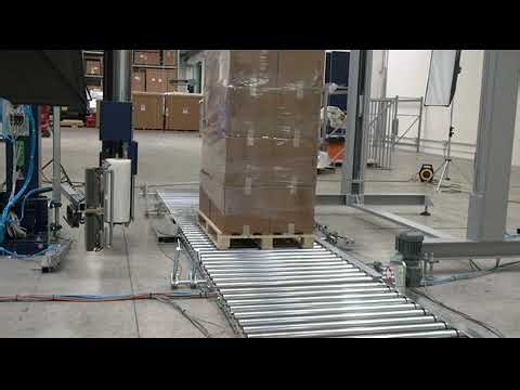 Rototech 3000 rotating arm stretch wrapper with floor level conveyor