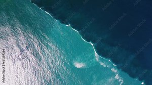 Boundary zone in the Atlantic Ocean. Aerial view of the dividing line of blue offshore water and murky coastal water in the ocean. Ocean water colliding zone