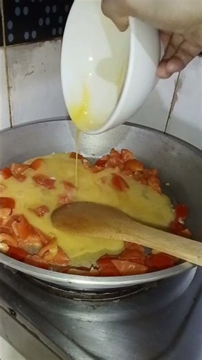scrambled eggs 🥚🥚🥚with tomatoes🍅🍅🍅