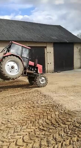 Tractor Stunt Show: Balancing Act on Rear Wheels