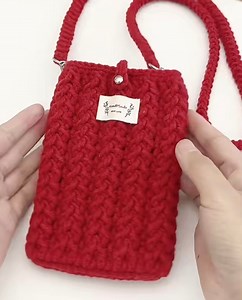 Learn how to crochet a stylish and cozy phone bag with a beautiful textured stitch pattern—perfect for fall and winter. This step-by-step video tutorial is beginner-friendly and uses worsted-weight yarn with a 3.5 mm crochet hook. You’ll learn how to crochet the oval base, build the bag body with an eye-catching raised stitch, add a button loop, and finish with a shrimp stitch strap. Great for everyday use or as a handmade gift. #crochetphonebag #crochetbagtutorial #crochetbeginner #handmadecroc