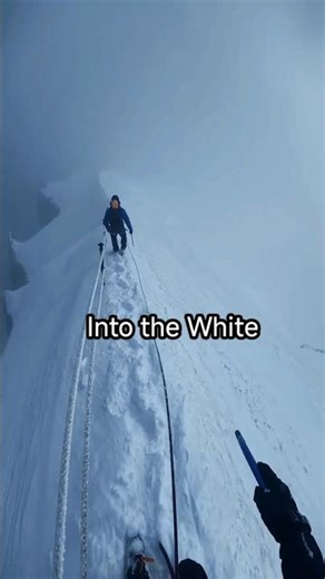 Ryan Perdi Mountaineering in Whiteout Conditions on a Narrow Snow Ridge