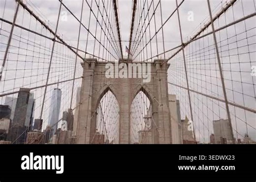 Brooklyn Bridge cables with Manhattan skyline in New York City.
