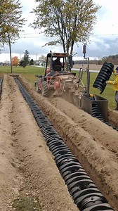Adam Faeth of A&D Excavating in New Riegel, OH can lay and backfill a 150’ trench of Infiltrator Quick4 36 LP chambers in 7 minutes with this 2' wide trencher and homemade chamber box. | Infiltrator Water Technologies
