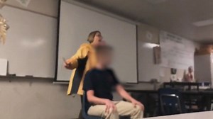 Teacher forcibly cuts off student's hair