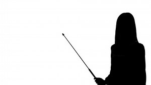 Silhouette of woman using a pointer.
