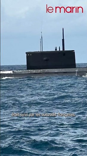 🌊💥 A Russian submarine surfaces next to a French trawler