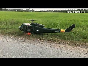 UH1D flies on beautiful rice fields