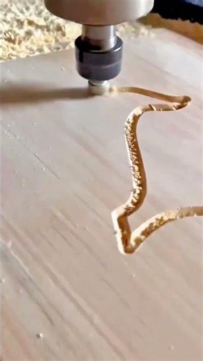 carving intricate patterns on flat wooden surfaces using a high speed rotary power tool bit daily