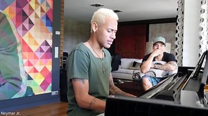 Footballer Neymar tries out 'singing' while playing the piano