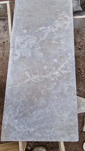 Making large format limestone for large stepping stones by joining different slabs together using resin bonding joins with aluminium busicuitw. I crack one tile and then make a crack vein effect to match existing veins. This is one of 14. @hhtilingtools making life easy as always with the blades 😉😀 I love being able to be trusted for this specialist work and get paid specifically for it. - - - - - #tilesetter #landscapers_of_instagram #mastercraft #gamechanger #foryoupage | Broad Landscapes