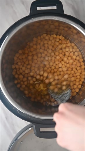 I use my Instant Pot to make chickpeas almost more than any other recipe (other than rice!). Dry chickpeas cook in about an hour from start to finish, which is much quicker than beans on the stovetop! | Cozy Peach Kitchen - Cassidy Reeser, RDN