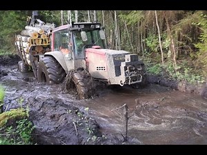 Valtra forestry tractor logging in spring forest