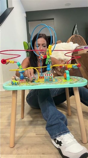 A colorful activity table that encourages fine motor skills, creativity, and independent play