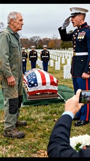HE INTERRUPTED A MILITARY FUNERAL—AND EVERY MARINE FOLLOWED HIM INTO THE CEMETERY Nobody saw him at first. Just an old man in faded green coveralls, limping through Arlington like he belonged to the earth itself. His boots were worn to the sole. His gaze? Sharper than the rifles lined up to salute the dead. He looked like a groundskeeper. But he moved like a man on a mission. The funeral had already begun—polished boots, white gloves, a flag folded so tight it might as well have been prayer. A w