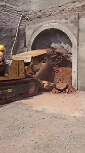 Excavation of tunnel using a roadheader! A roadheader is a heavy construction machine used to excavate tunnels, typically in mining or civil engineering projects. It's equipped with a rotating cutting head that's able to move across the tunnel face, cutting and excavating the rock or soil. You can learn all tunnelling methods in our online Tunnel Engineering course. This is a great course if you want to succeed in your tunnelling career as a Tunnel Engineer. It give you practical knowledge to be