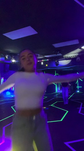 Dazzling Dance Performance in Neon Atmosphere