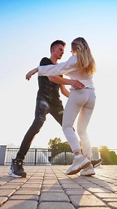 Dancing together outdoor. Vertical