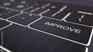 Tracking shot of modern black computer keyboard and luminous improve key. Conceptual 4K clip