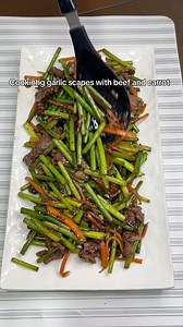 Cooking garlic scapes with beef and carrot #food #cooking #reels | Pai Kang