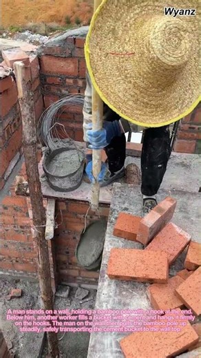 Workers Transporting Cement Bucket with Bamboo Pole on Wall